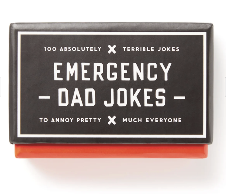 Box of 'Emergency Dad Jokes' with black and white design on a white background
